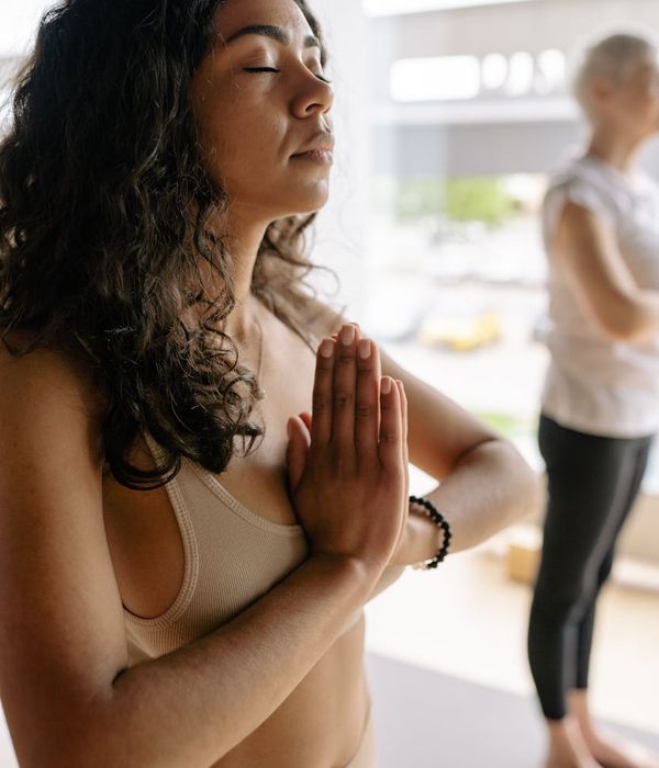 Woman in a calm, seated yoga pose, embodying inner peace and stability.
